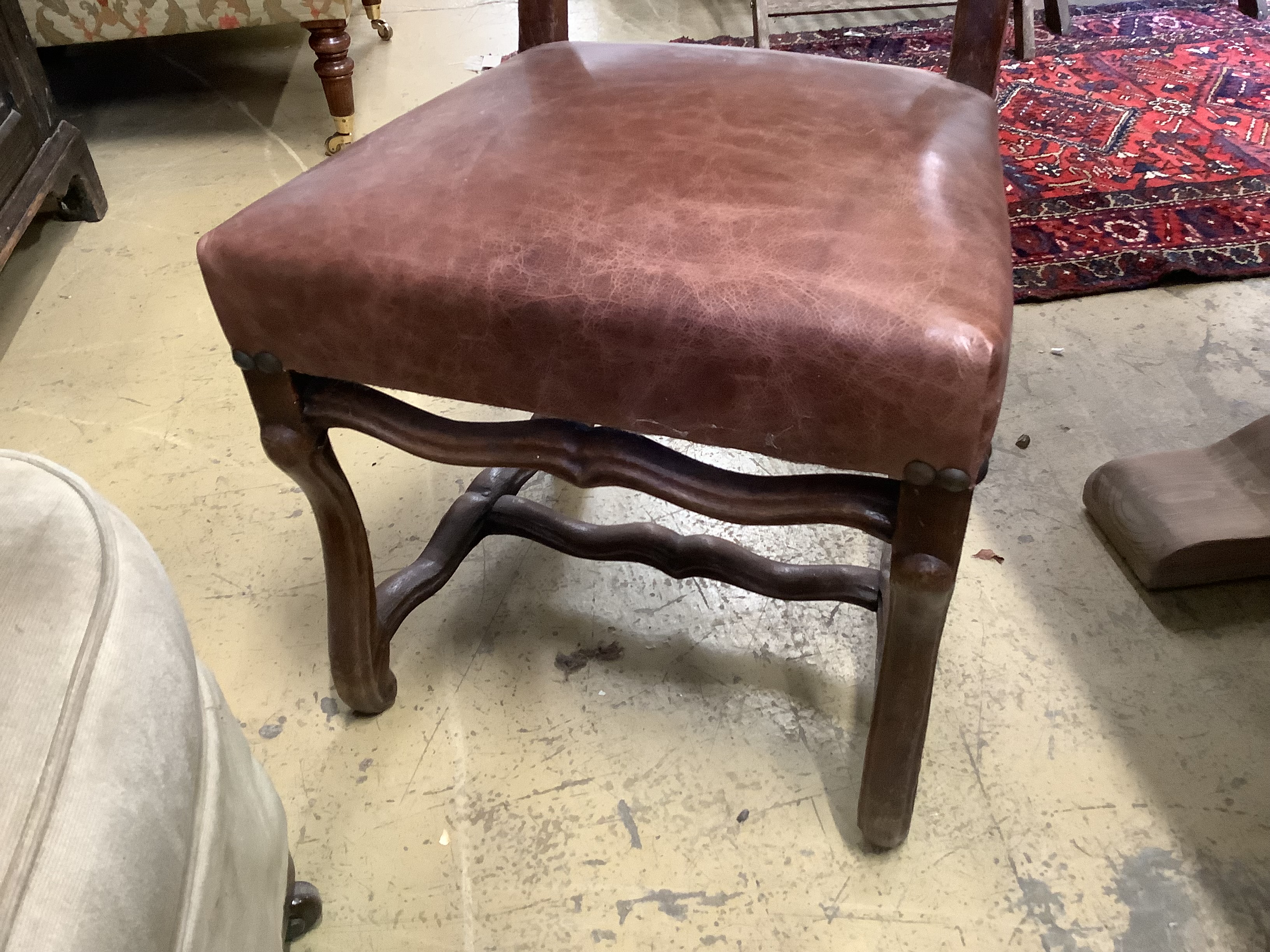 A set of six French leather high back dining chairs